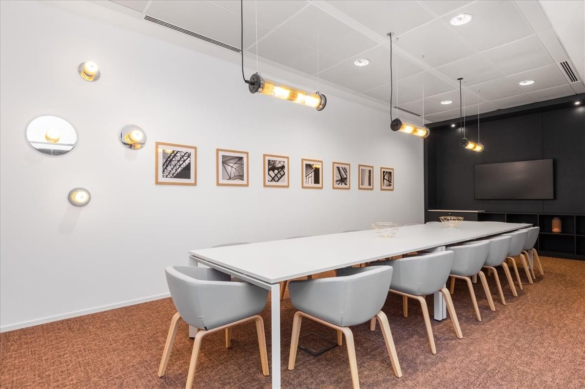 A professional boardroom at The View by The Waterway South, Fifth Settlement, New Cairo with a long white table.