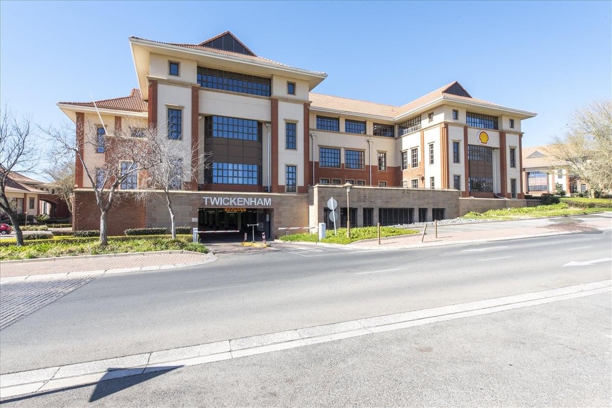 Exterior view of the classic multi-story Twickenham Building, The Campus featuring a brick and stone facade.