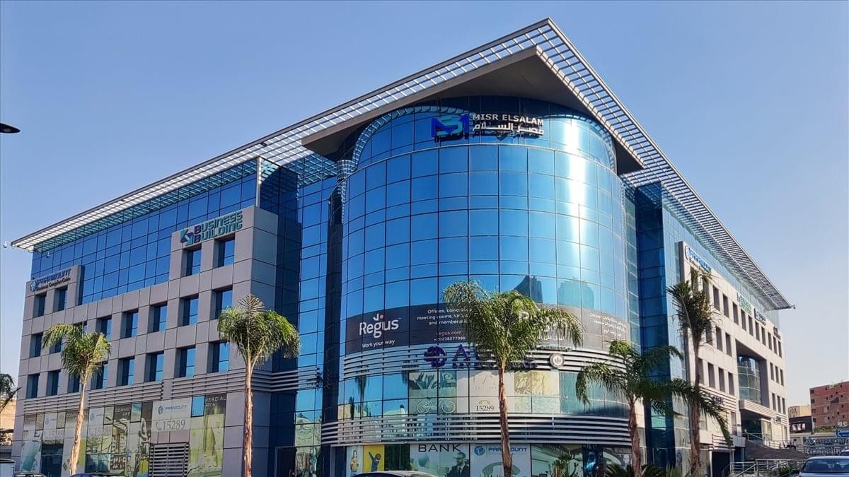 Exterior view of the blue glass facade at Paramount Business Complex.
