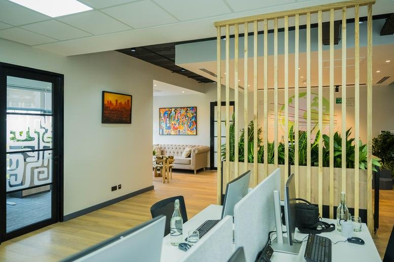 Spacious reception area at Riverside Square, 10th Floor, 104 Riverside Drive with wooden slats and indoor plants.