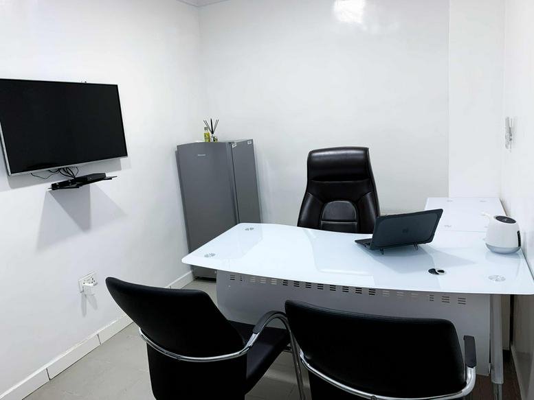 Modern open-plan office at 2nd Floor, Wing 5, 4C Idowu Martins Street with white desks and black ergonomic chairs.