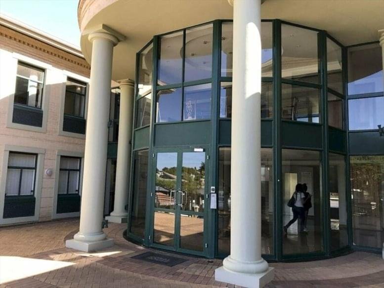 Exterior view of Coral House, 20 Peter Place with glass entrance and columns.